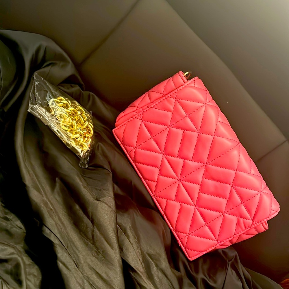 Cute padded brand new pink hand bag with gold chain strap